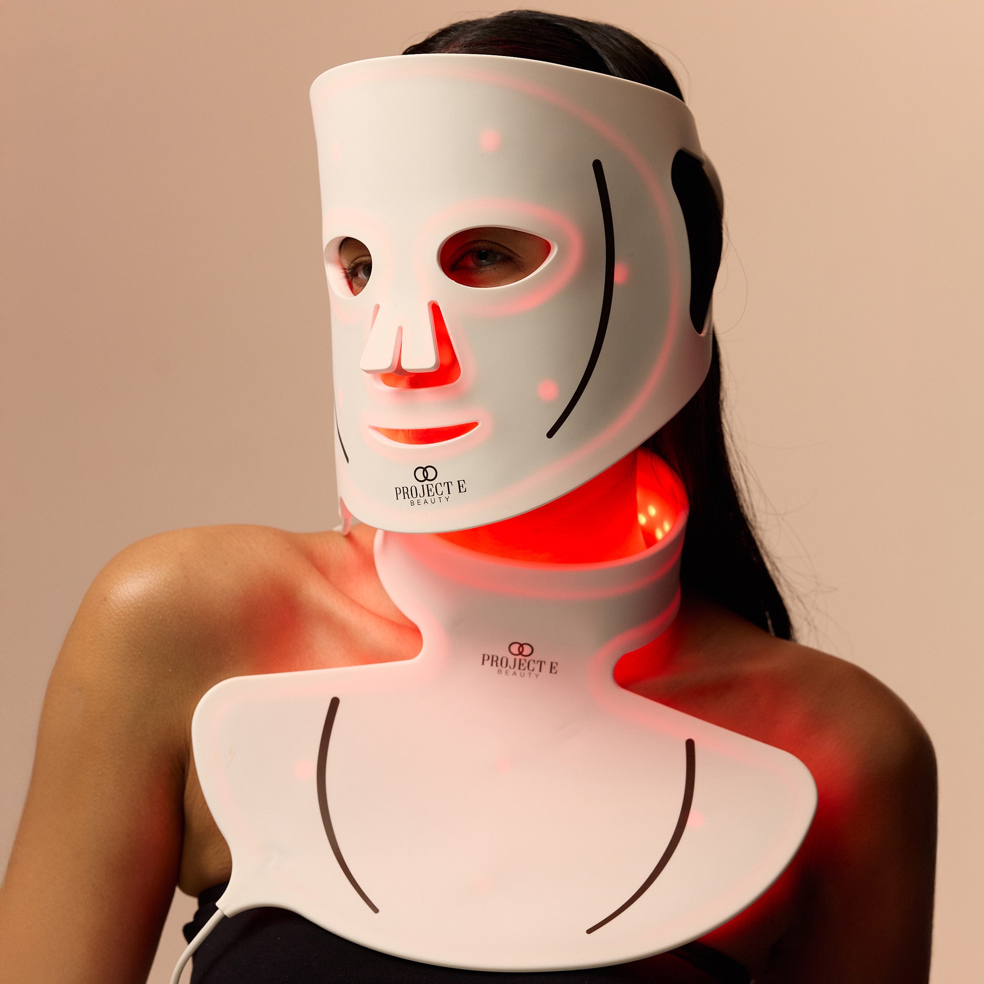 Female enhancing skin rejuvenation with red light therapy.